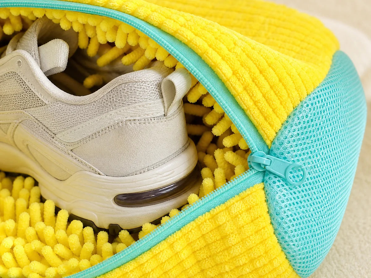 Close view of the soft chenille fibers and aqua zipper around a sneaker